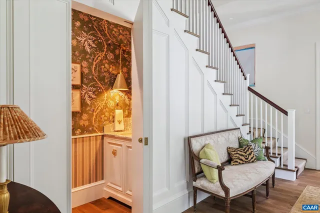 a spacious bathroom with a granite countertop sink and a mirror