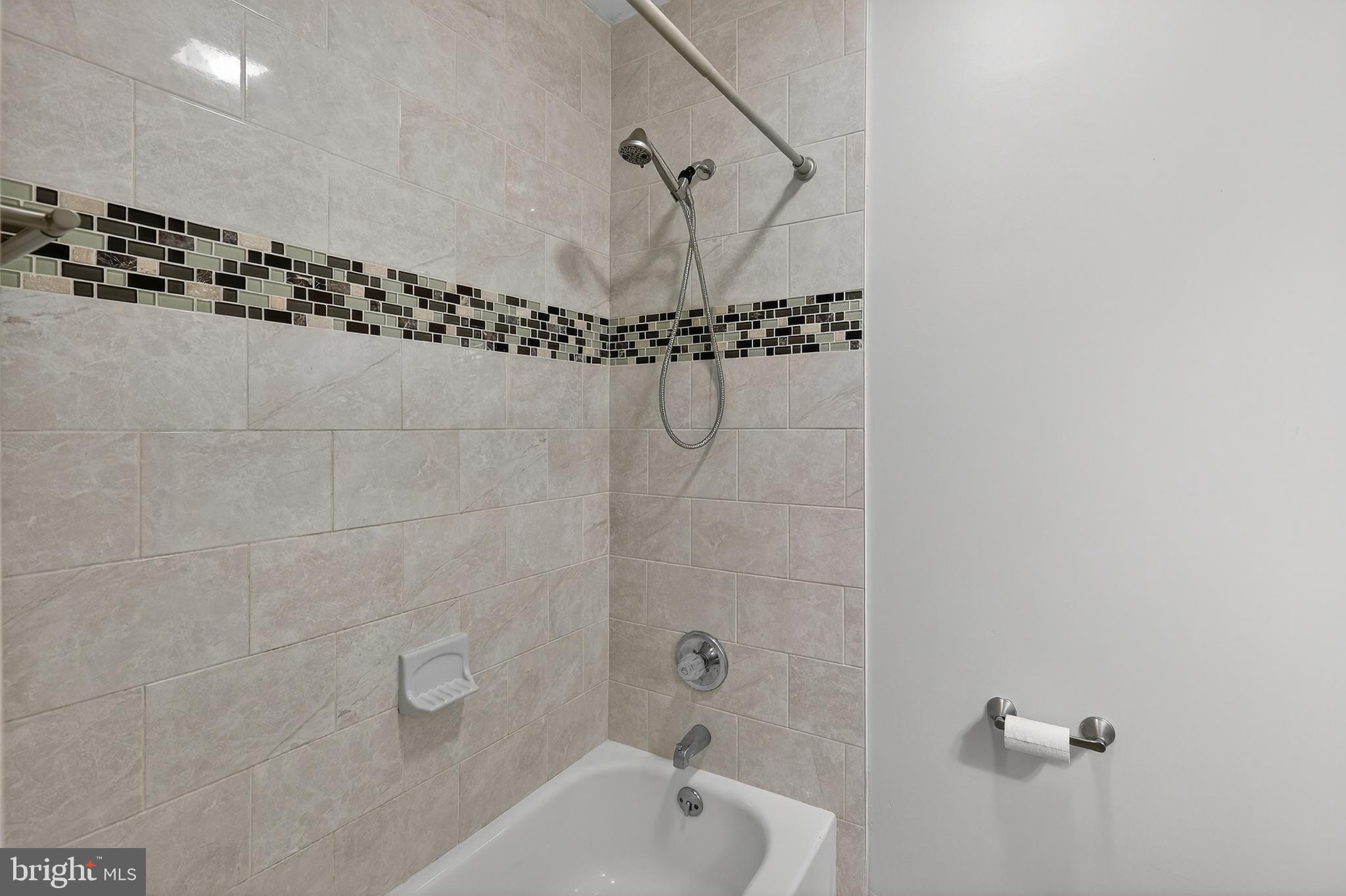 5619 1st Street Northwest, Unit 2 Washington, DC 20011 - Photo 25 of 27 a bathroom with a shower and a bathtub