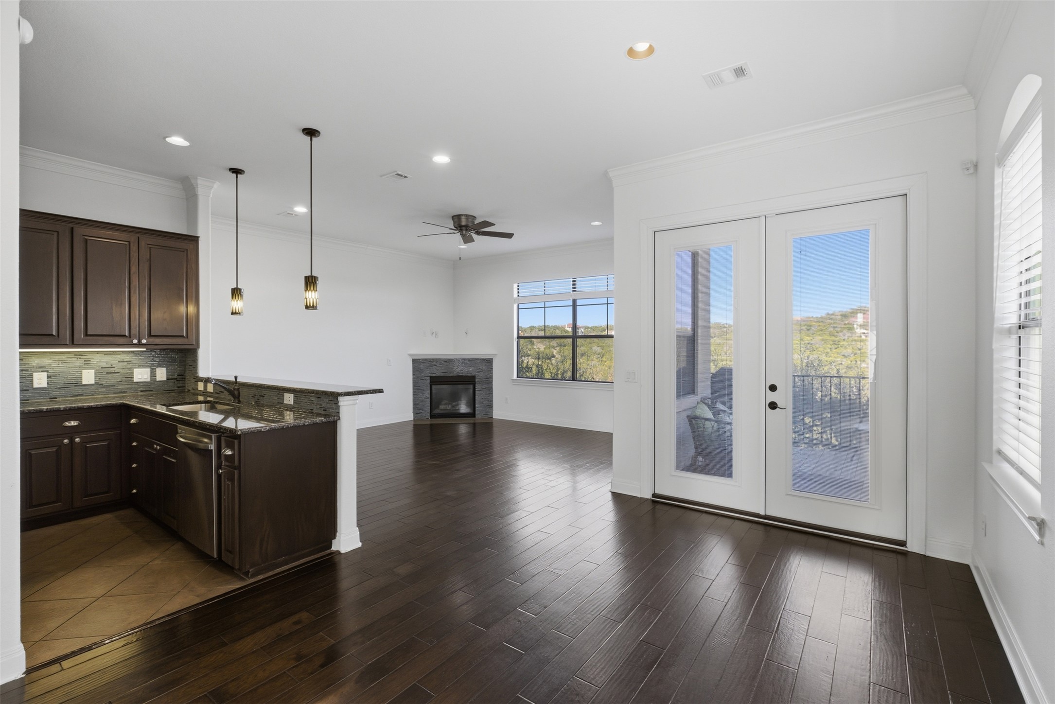 4000 Ranch Road 620 North, Unit 19 Austin, TX 78734 - Photo 39 of 39 an open kitchen with wooden floor and large cabinets