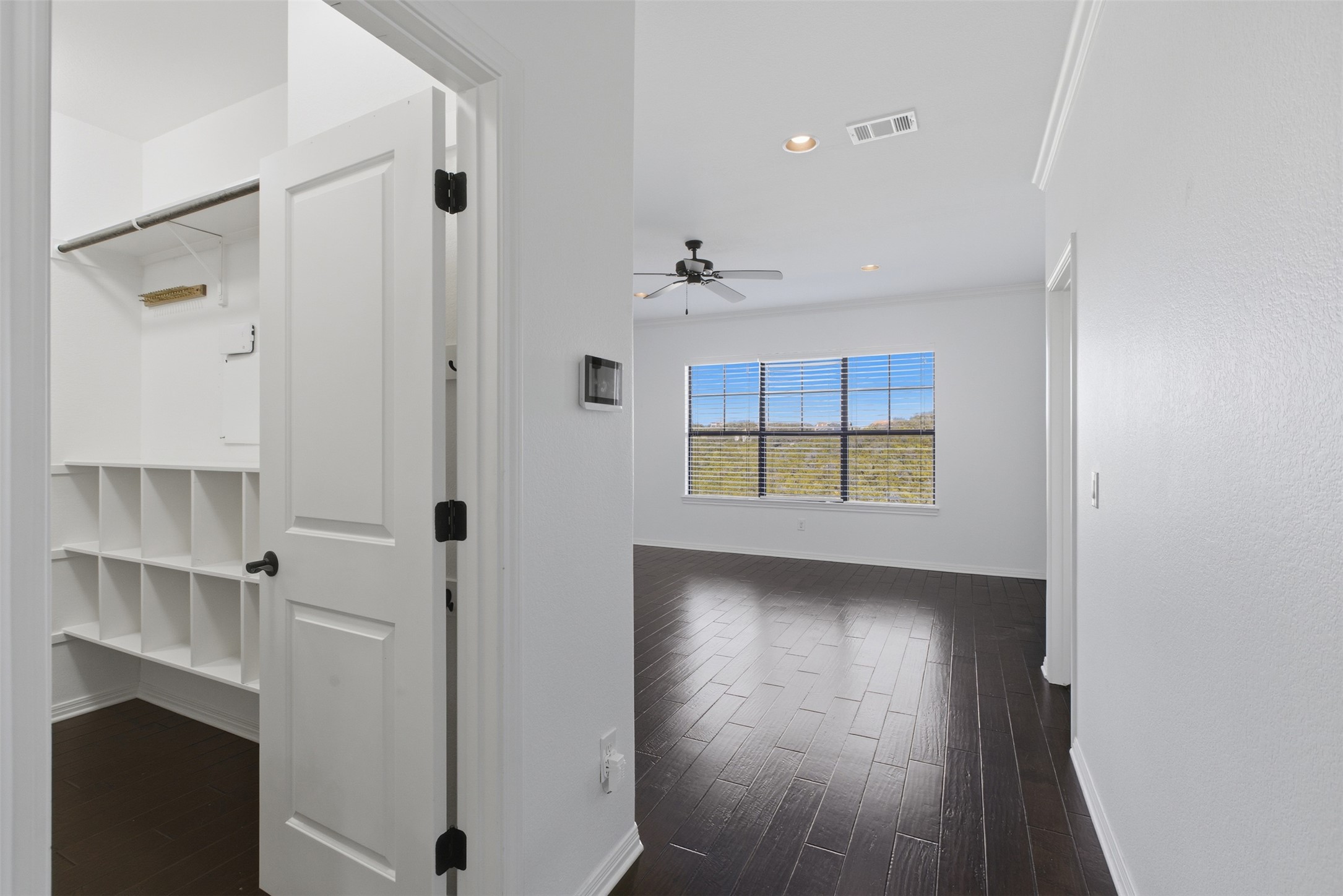 4000 Ranch Road 620 North, Unit 19 Austin, TX 78734 - Photo 19 of 39 a view of an empty room with a window and wooden floor
