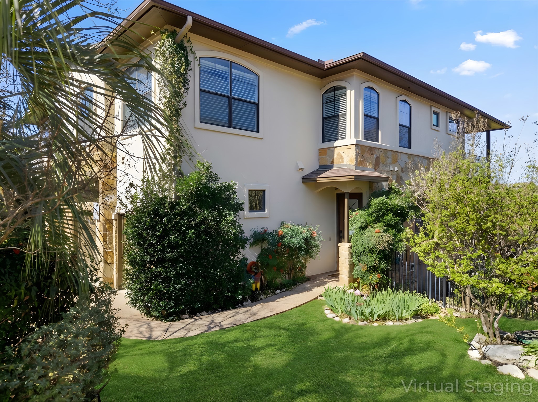 4000 Ranch Road 620 North, Unit 19 Austin, TX 78734 - Photo 2 of 39 a front view of a house with a yard and trees