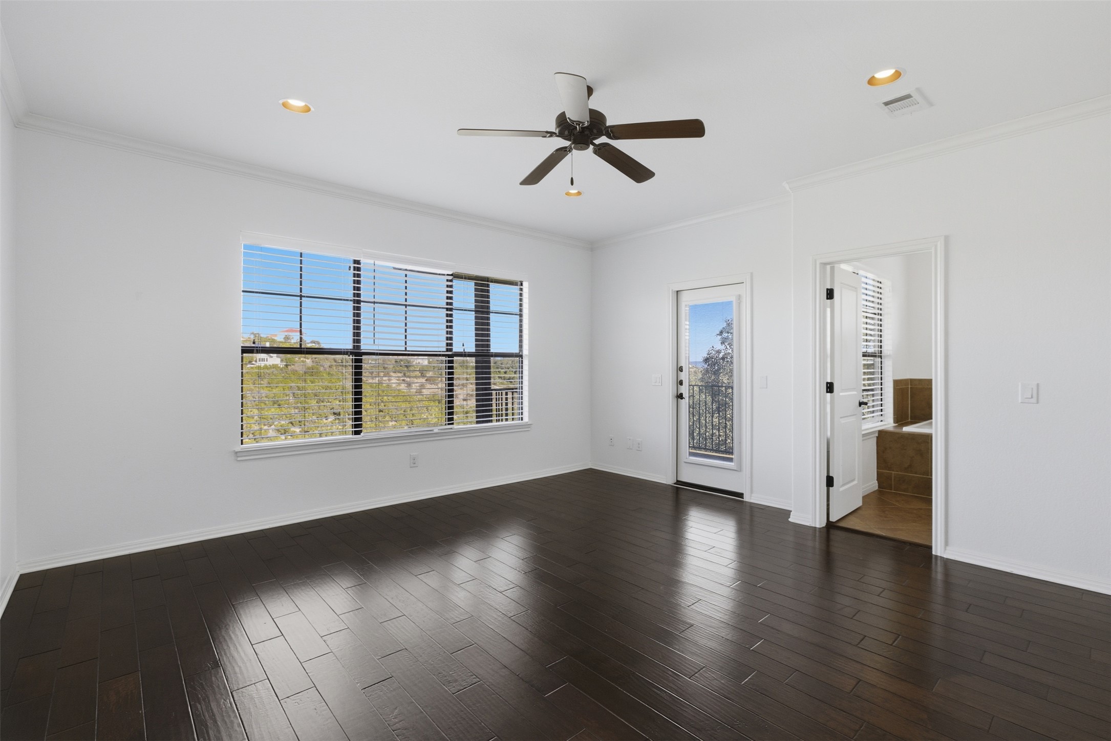 4000 Ranch Road 620 North, Unit 19 Austin, TX 78734 - Photo 22 of 39 a view of an empty room with a window and wooden floor