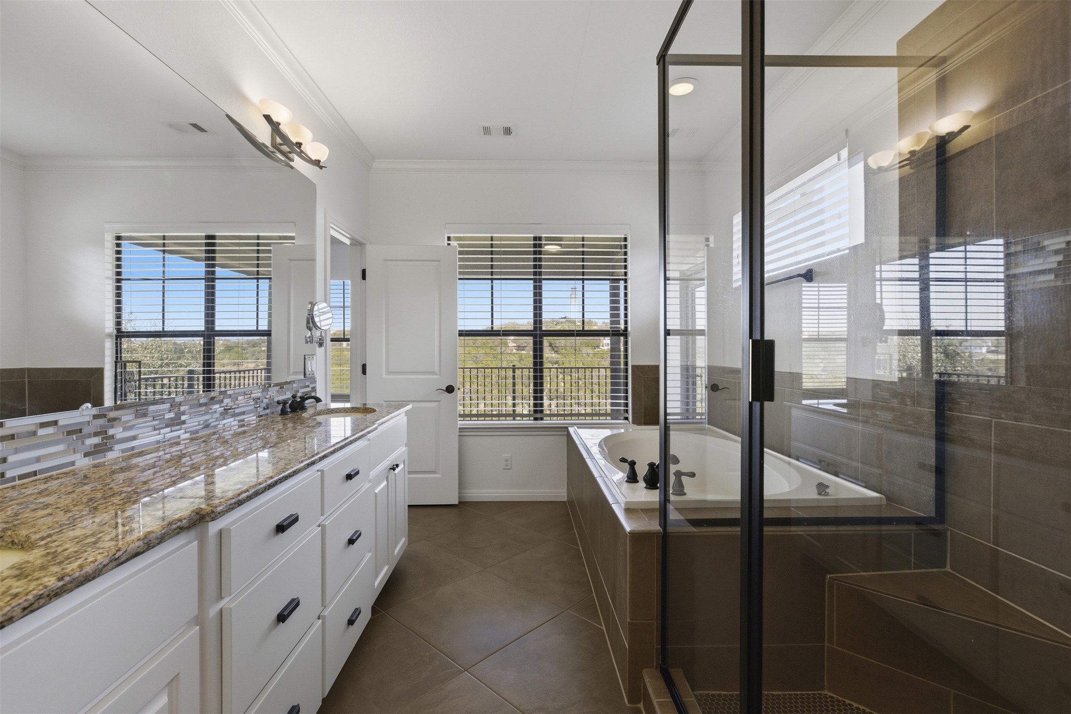 4000 Ranch Road 620 North, Unit 19 Austin, TX 78734 - Photo 23 of 39 a bathroom with double vanity and a bathtub