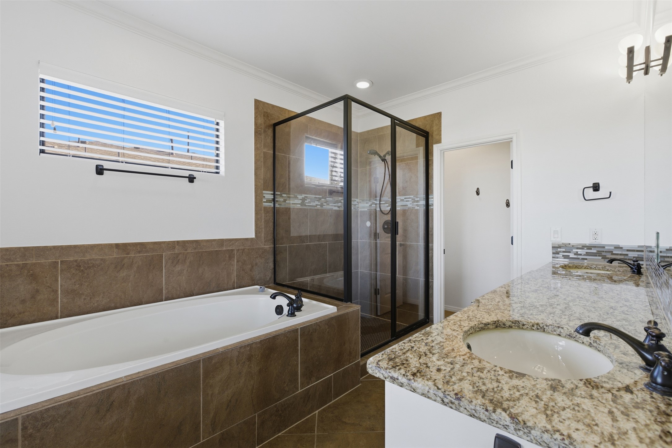 4000 Ranch Road 620 North, Unit 19 Austin, TX 78734 - Photo 24 of 39 a bathroom with a granite countertop sink and a bathtub