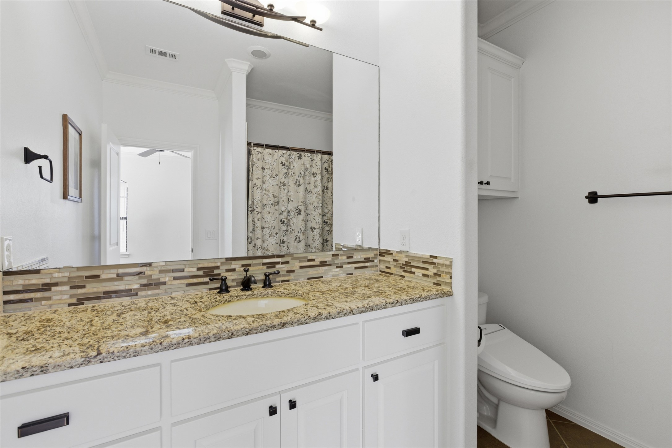4000 Ranch Road 620 North, Unit 19 Austin, TX 78734 - Photo 28 of 39 a bathroom with a granite countertop sink and a mirror