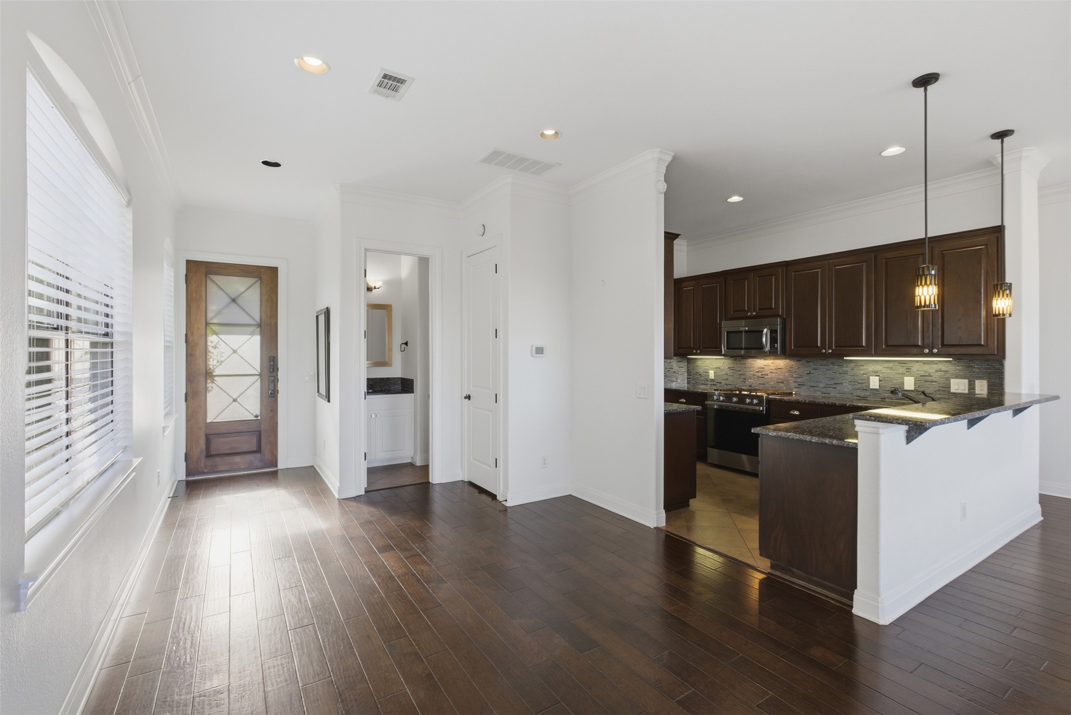 4000 Ranch Road 620 North, Unit 19 Austin, TX 78734 - Photo 6 of 39 a view of kitchen with refrigerator stove and wooden floor