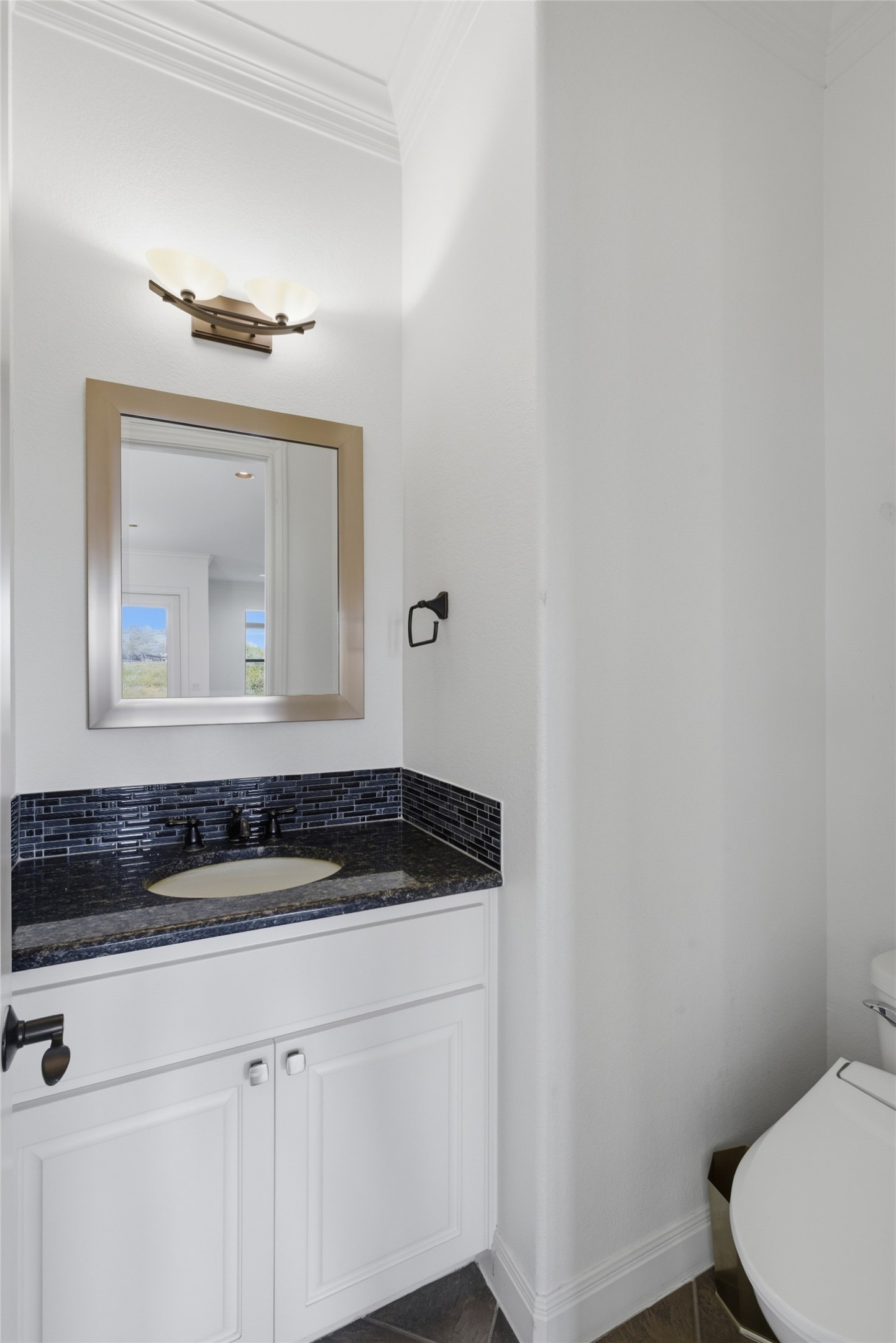 4000 Ranch Road 620 North, Unit 19 Austin, TX 78734 - Photo 7 of 39 a bathroom with a sink a toilet and mirror