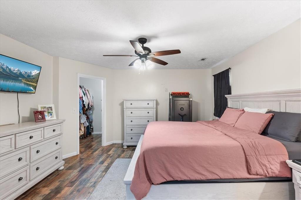 8 Stonegate Drive Cedartown, GA 30125 - Photo 17 of 42 a bedroom with a bed and a dresser in it