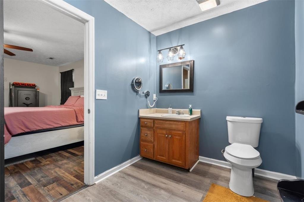 8 Stonegate Drive Cedartown, GA 30125 - Photo 22 of 42 a spacious bathroom with a toilet sink and mirror