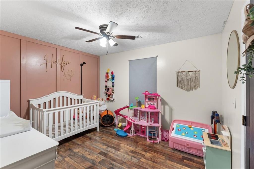 8 Stonegate Drive Cedartown, GA 30125 - Photo 25 of 42 a bedroom with furniture and baby crib