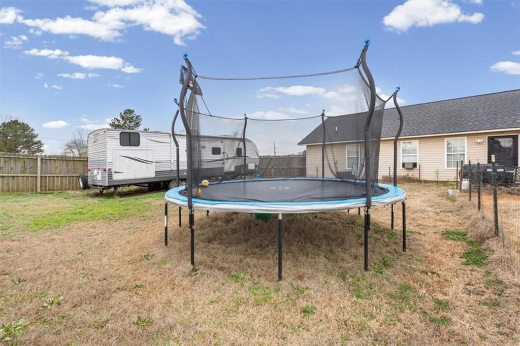 8 Stonegate Drive Cedartown, GA 30125 - Photo 31 of 42 a view of a backyard with table and chairs
