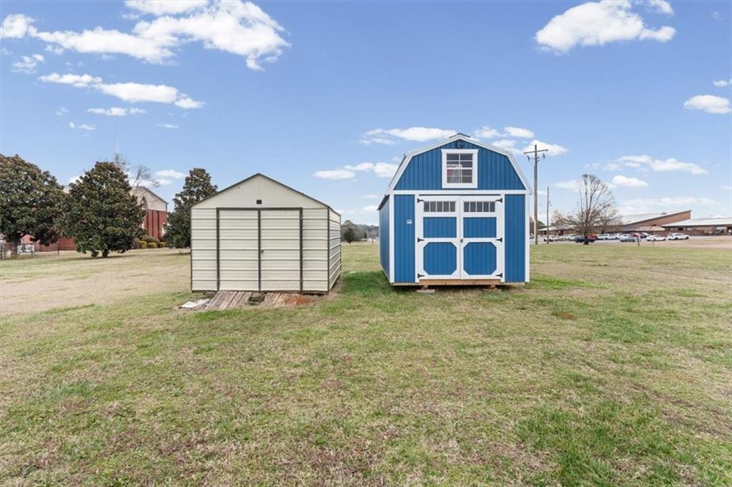 8 Stonegate Drive Cedartown, GA 30125 - Photo 35 of 42 a view of a house with a yard and garage