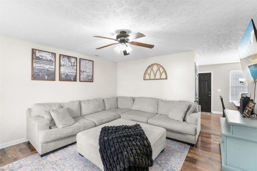 8 Stonegate Drive Cedartown, GA 30125 - Photo 5 of 42 a living room with furniture and a chandelier