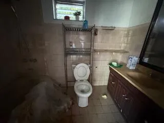 a bathroom with a toilet and a sink