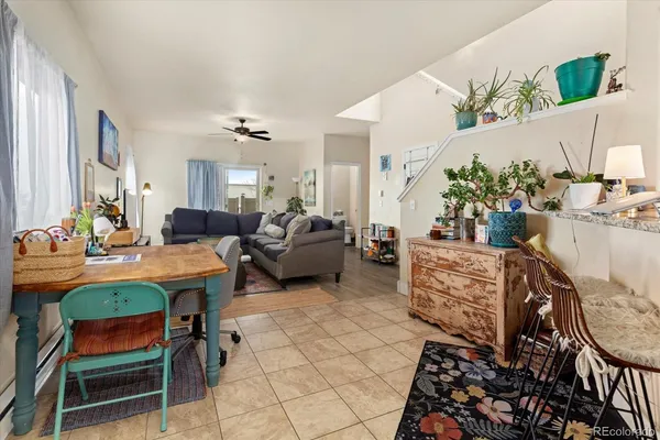 a living room with granite countertop furniture and a fireplace