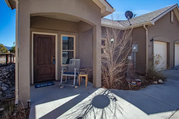 a view of a house with wooden fence