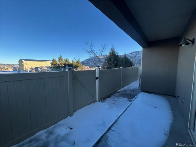 a view of a house with wooden walls and floor to ceiling window