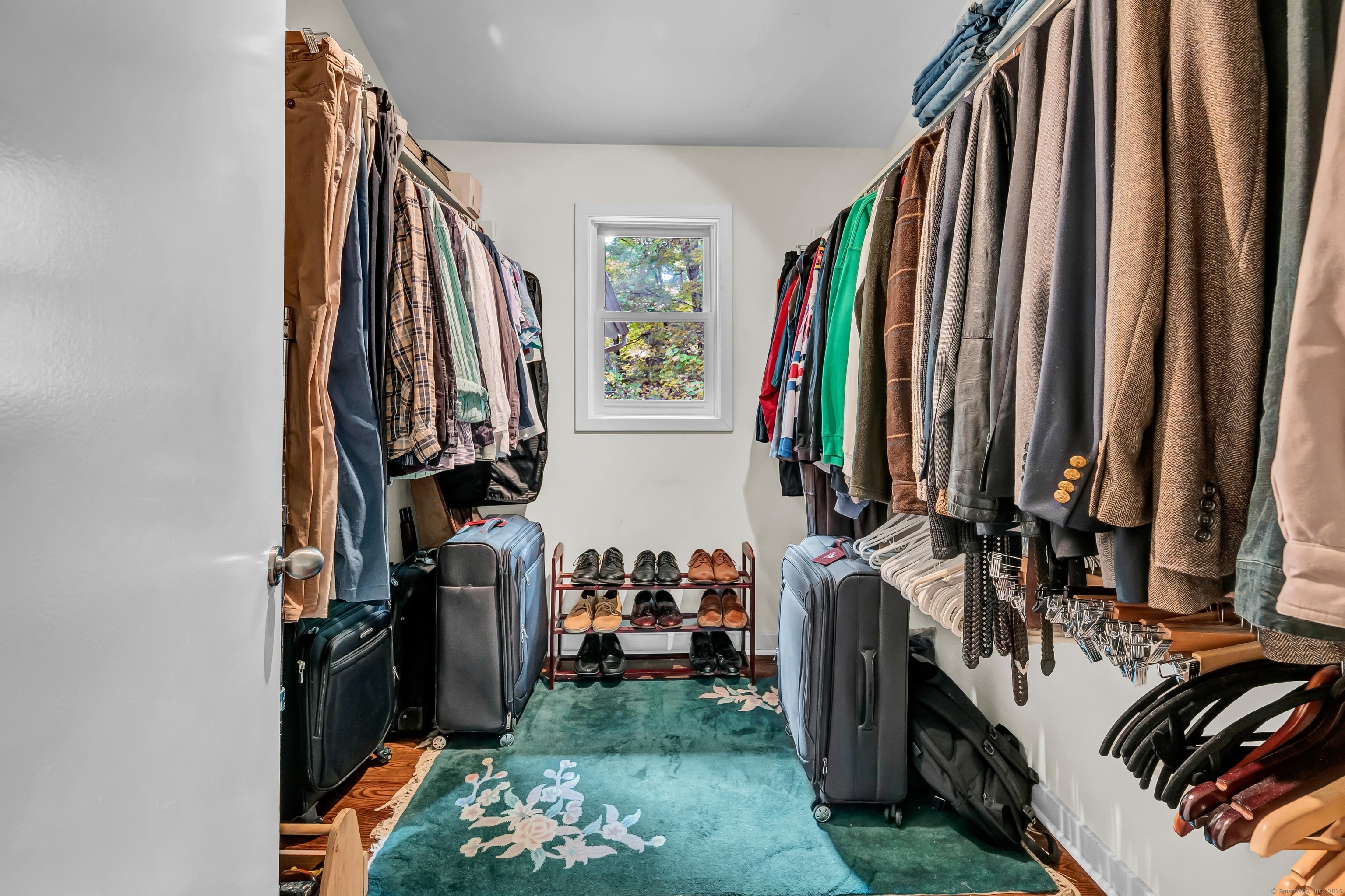 26 Cove Road Brookfield, CT 06804 - Photo 22 of 40 a view of walk in closet with clothes and shoes