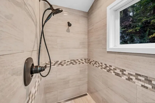 a bedroom with a bed and dresser