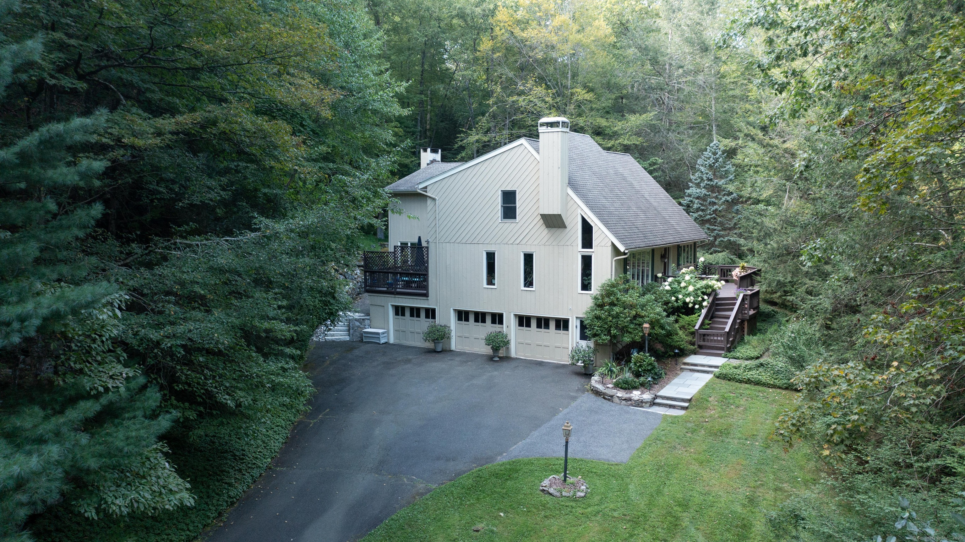 26 Cove Road Brookfield, CT 06804 - Photo 33 of 40 a view of a house with a small yard plants and large tree