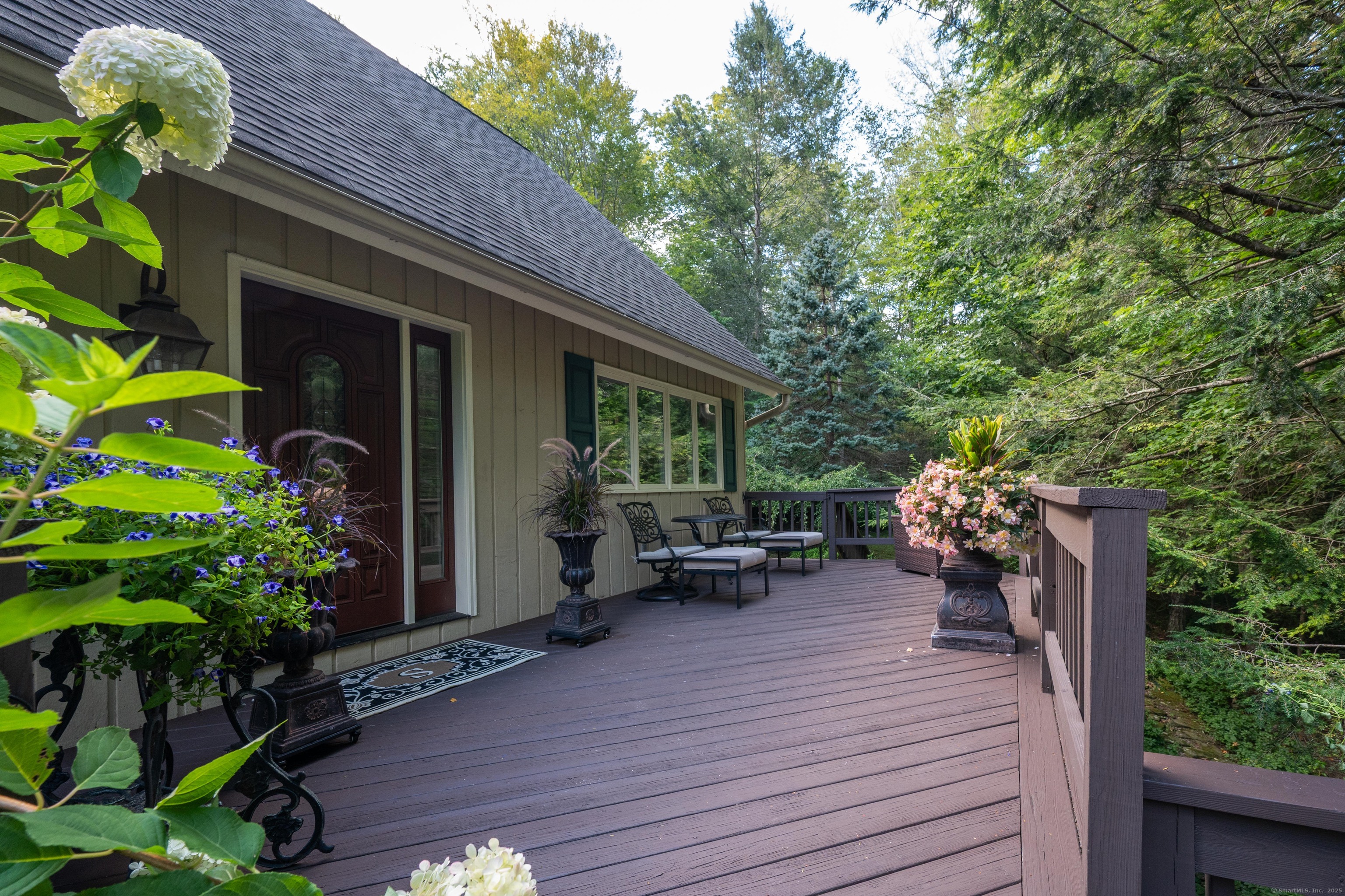 26 Cove Road Brookfield, CT 06804 - Photo 36 of 40 a view of a house with backyard and sitting area