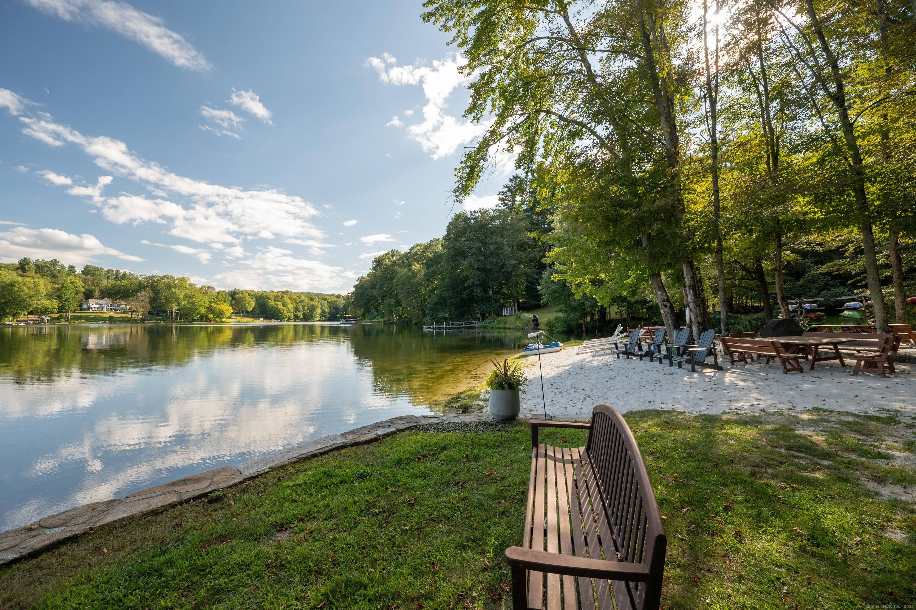 26 Cove Road Brookfield, CT 06804 - Photo 37 of 40 a view of a lake with a yard and large trees