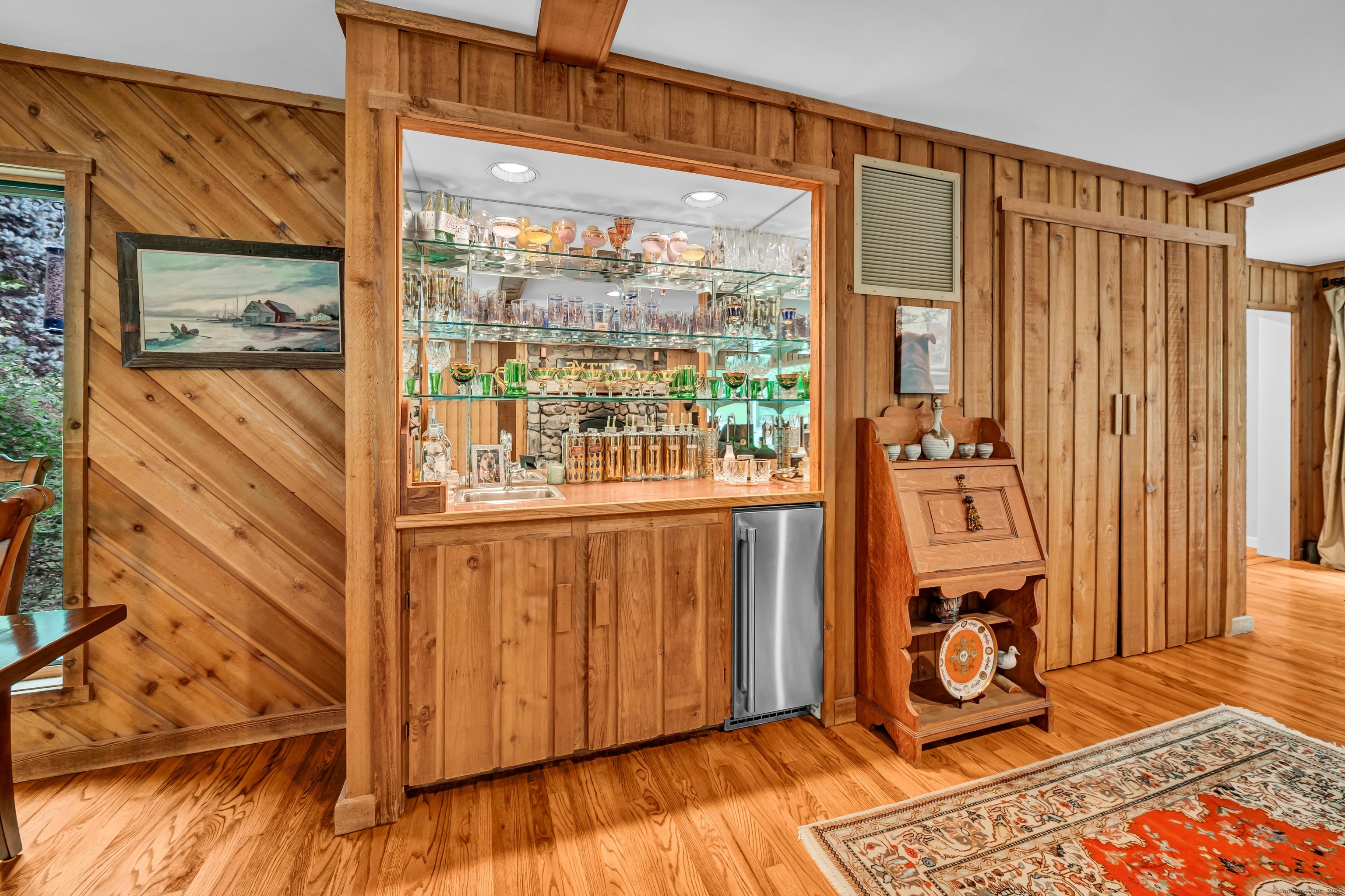 26 Cove Road Brookfield, CT 06804 - Photo 8 of 40 a view of a hallway with wooden floor and windows