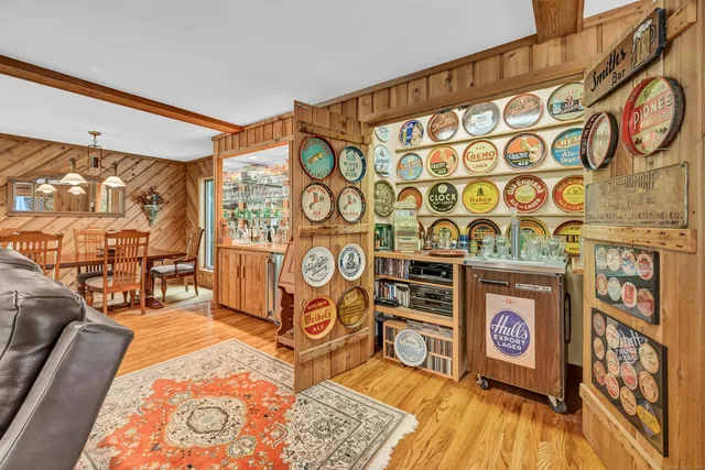 a view of a room with furniture and wooden floor