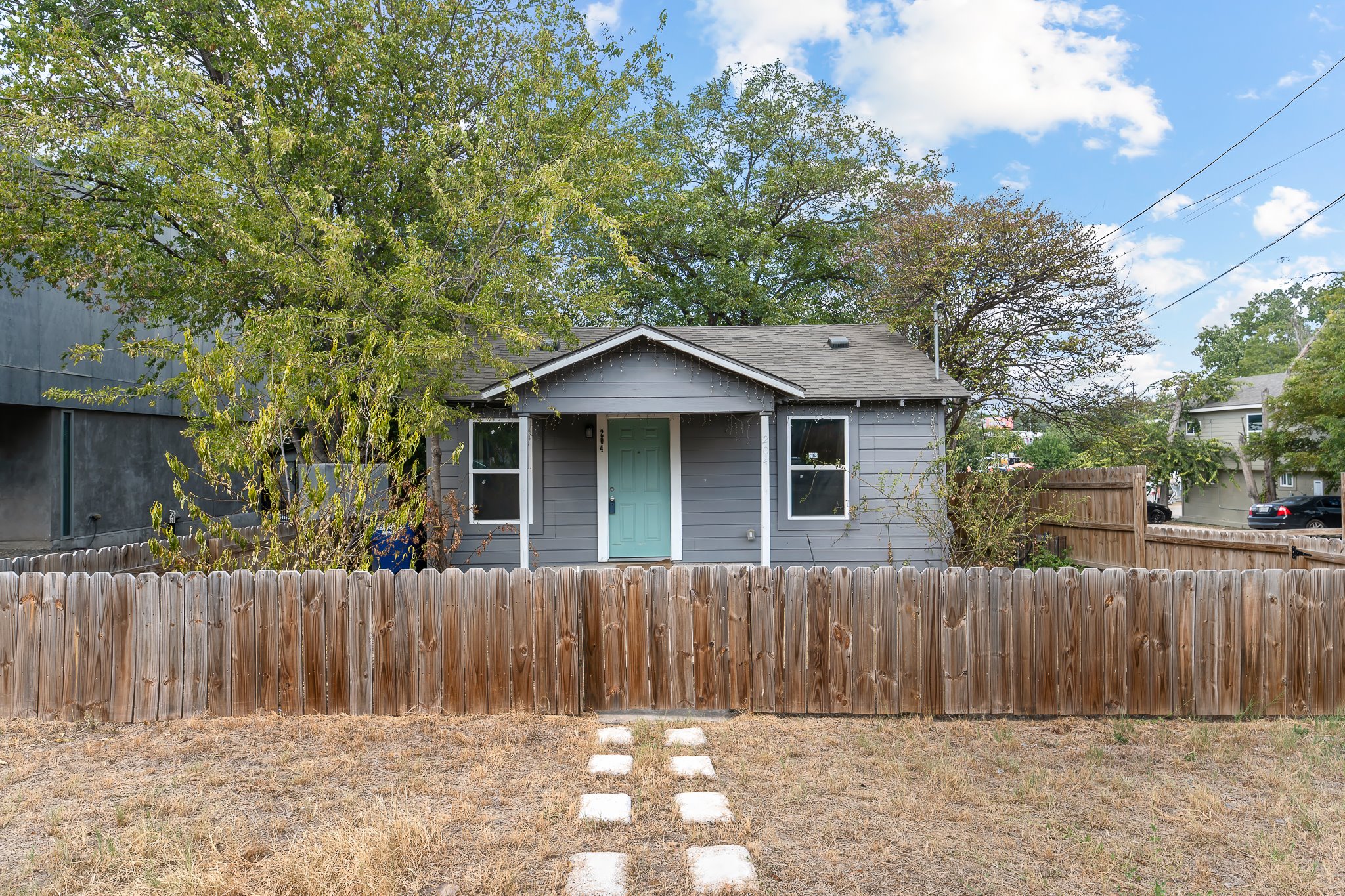 front view of a house with a fence