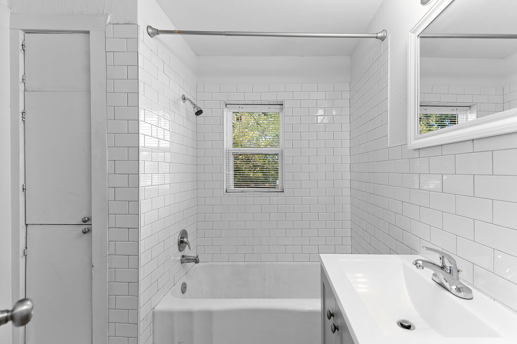 204 Lessin Lane Austin, TX 78704 - Photo 28 of 35 a bathroom with a sink a shower and a bathtub