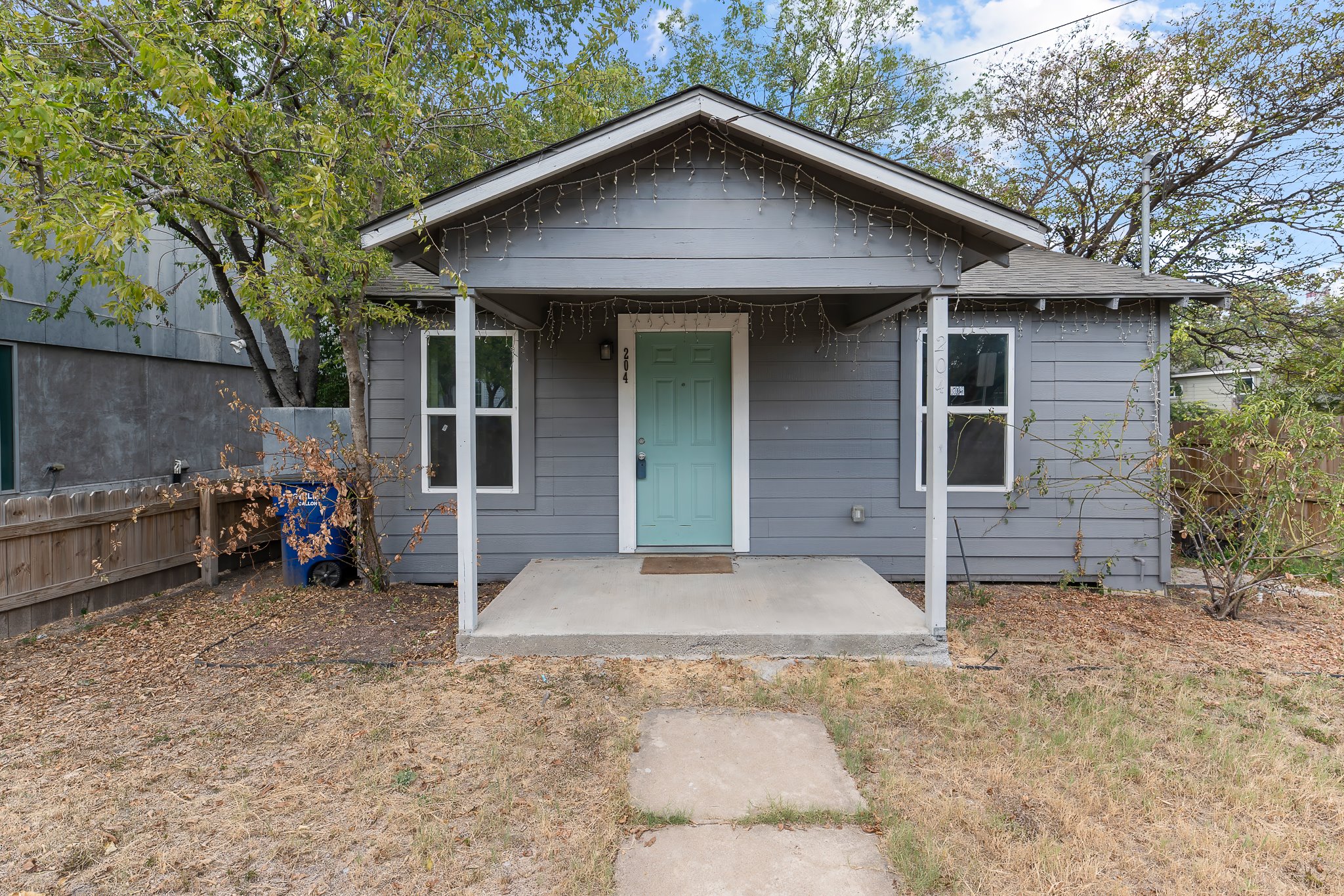 204 Lessin Lane Austin, TX 78704 - Photo 4 of 35 a view of a house with a yard and garage