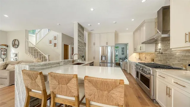 a bathroom with a granite countertop sink a toilet and shower