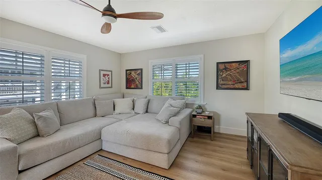 an aerial view of a house with a yard and a fountain