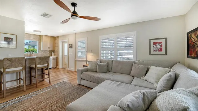 a view of swimming pool with chairs in patio