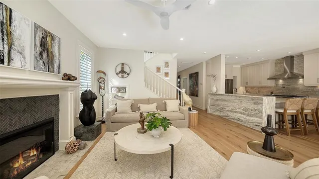 a kitchen with stainless steel appliances white cabinets and a stove top oven