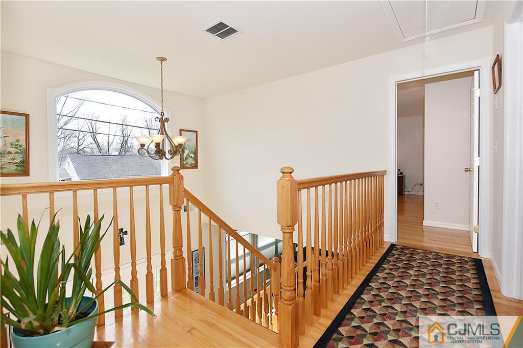 3 Caldwell Road Edison, NJ 08817 - Photo 16 of 25 a view of staircase with railing and a chandelier
