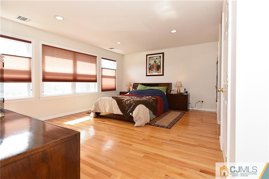 3 Caldwell Road Edison, NJ 08817 - Photo 17 of 25 a bedroom with a bed and wooden floor