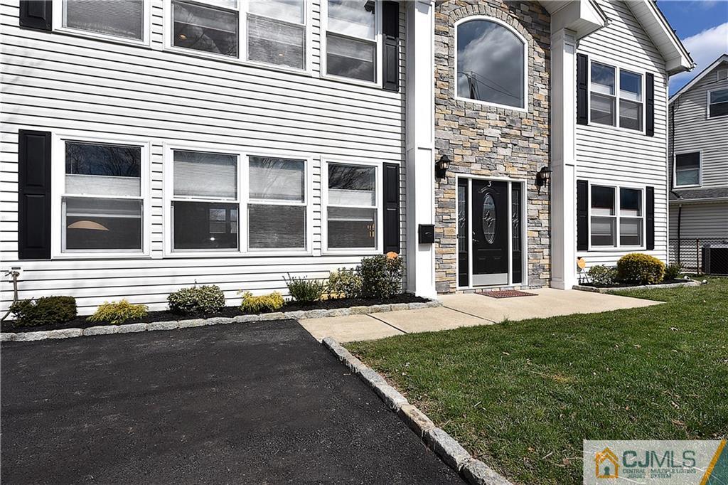 3 Caldwell Road Edison, NJ 08817 - Photo 3 of 25 a front view of a house with a yard