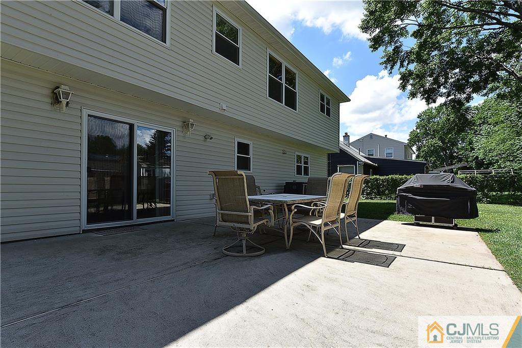 3 Caldwell Road Edison, NJ 08817 - Photo 24 of 25 a view of a patio with table and chairs and couches
