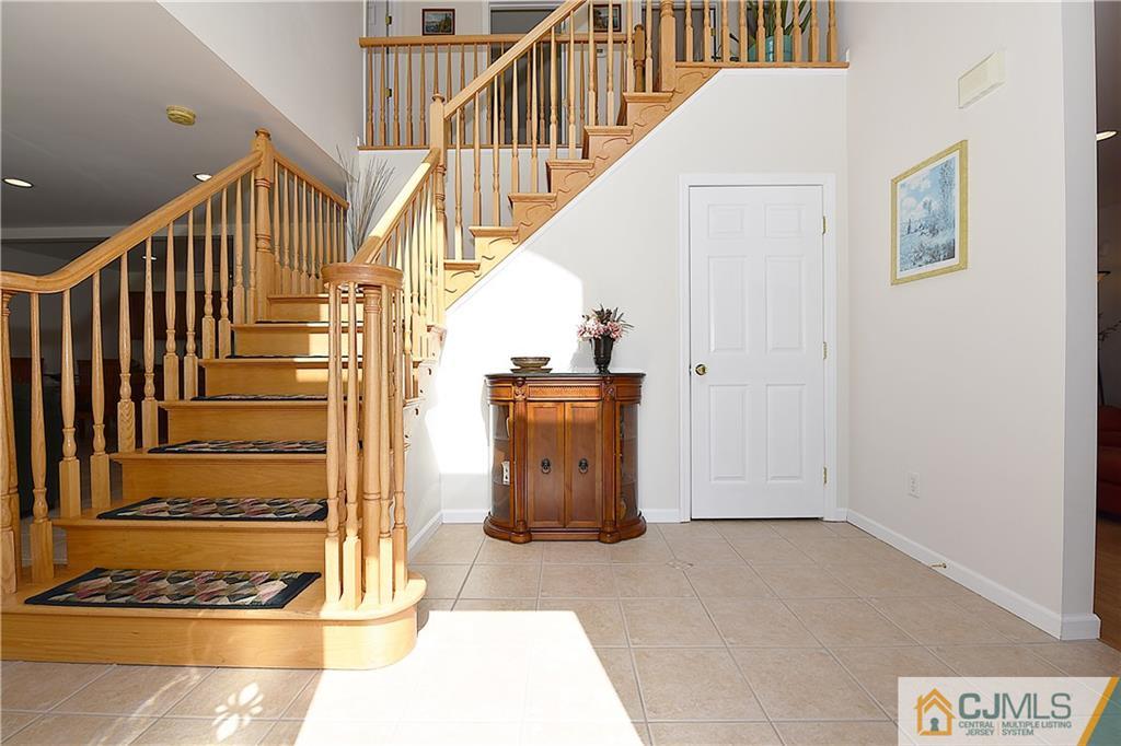 3 Caldwell Road Edison, NJ 08817 - Photo 4 of 25 a view of entryway with wooden floor and stairs