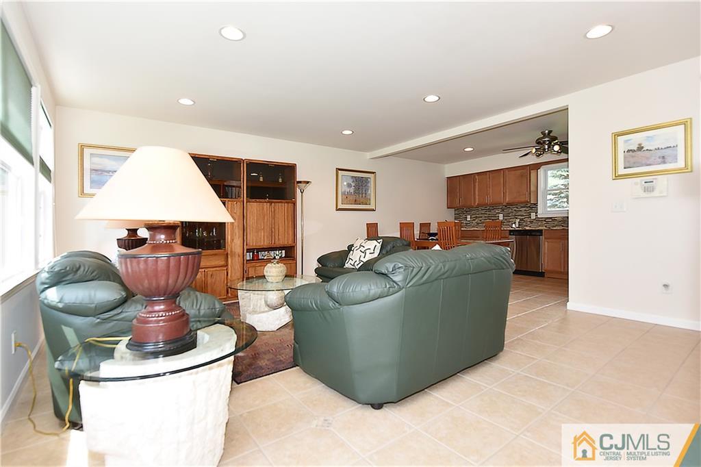 3 Caldwell Road Edison, NJ 08817 - Photo 9 of 25 a living room with furniture and kitchen view