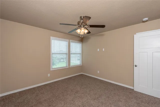 a room with chair and a mirror