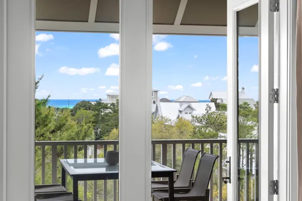 a view of a balcony with chairs