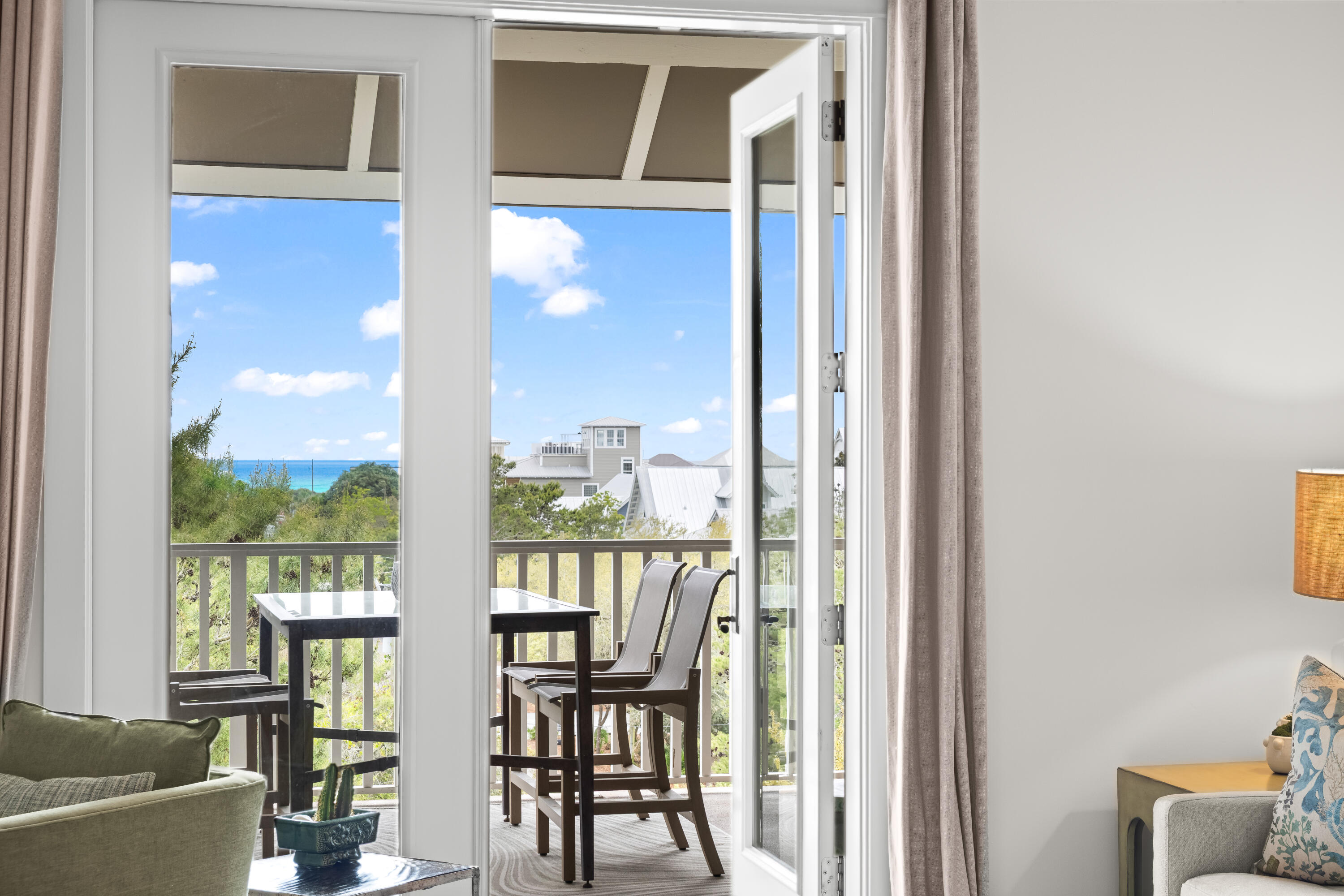 2046 West County Highway 30A, Unit M2428 Santa Rosa Beach, FL 32459 - Photo 2 of 72 a view of a livingroom with furniture wooden floor and windows