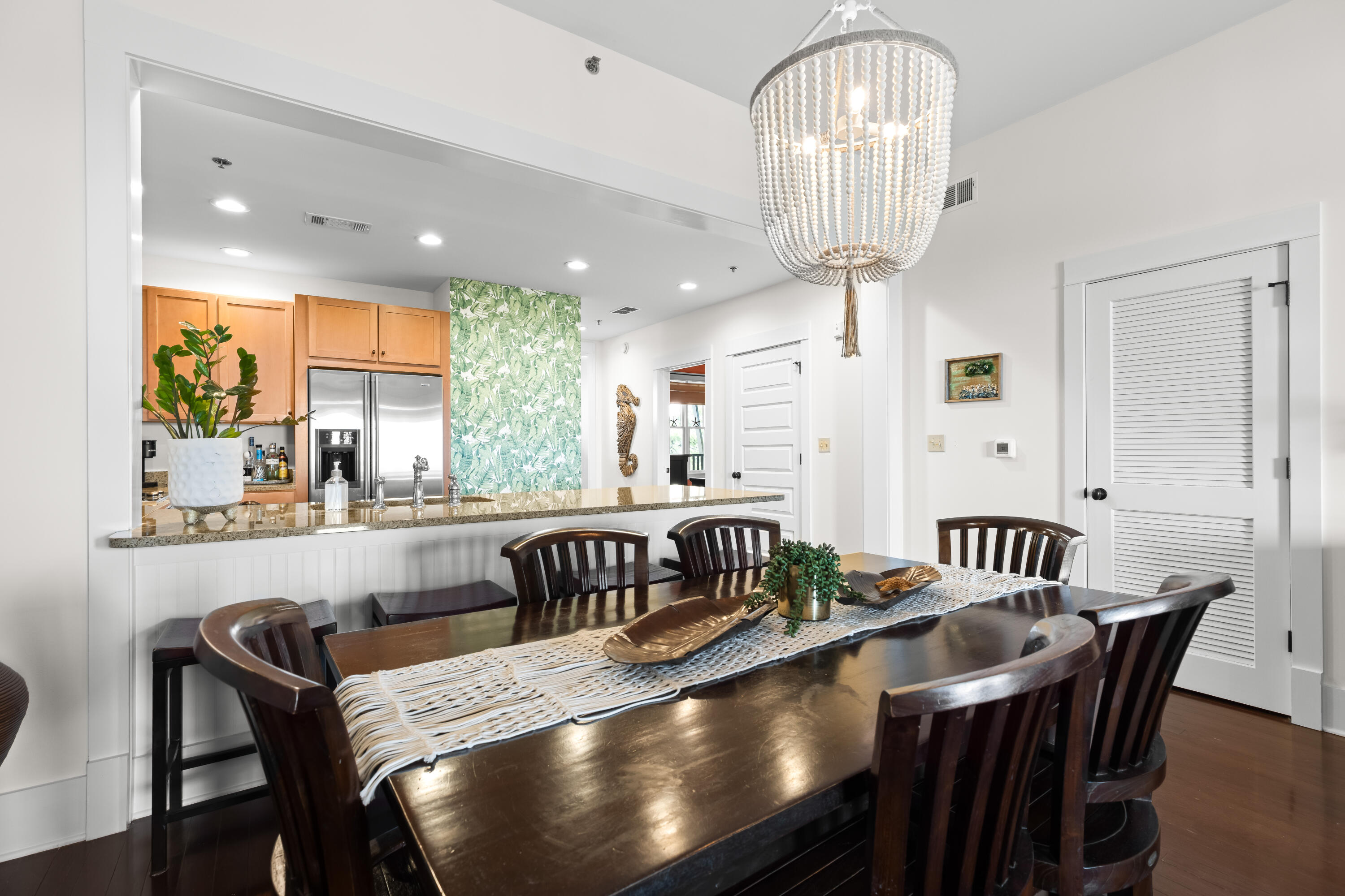 2046 West County Highway 30A, Unit M2428 Santa Rosa Beach, FL 32459 - Photo 21 of 72 a view of a dining room with furniture window and wooden floor
