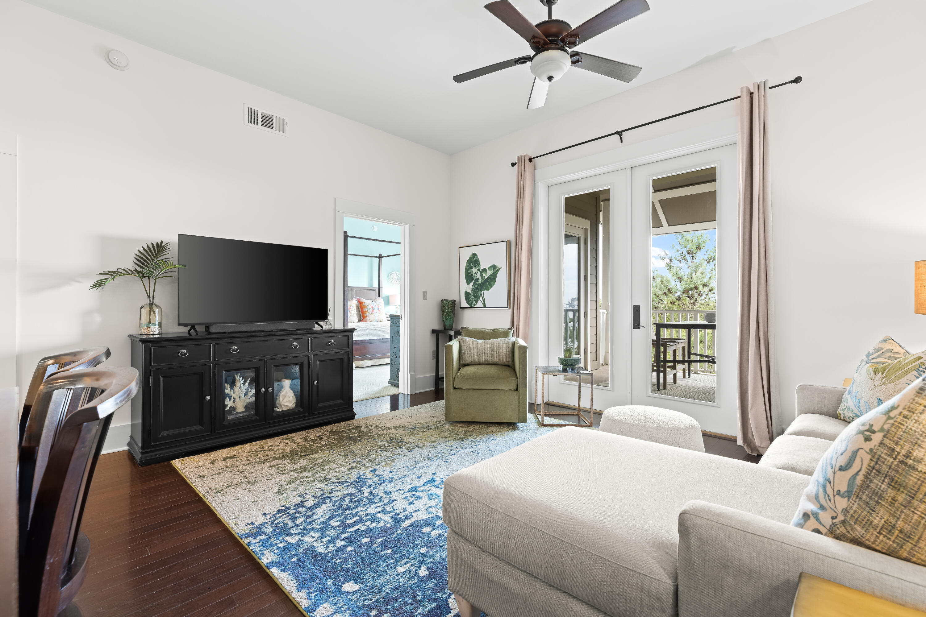 2046 West County Highway 30A, Unit M2428 Santa Rosa Beach, FL 32459 - Photo 23 of 72 a living room with furniture and a flat screen tv