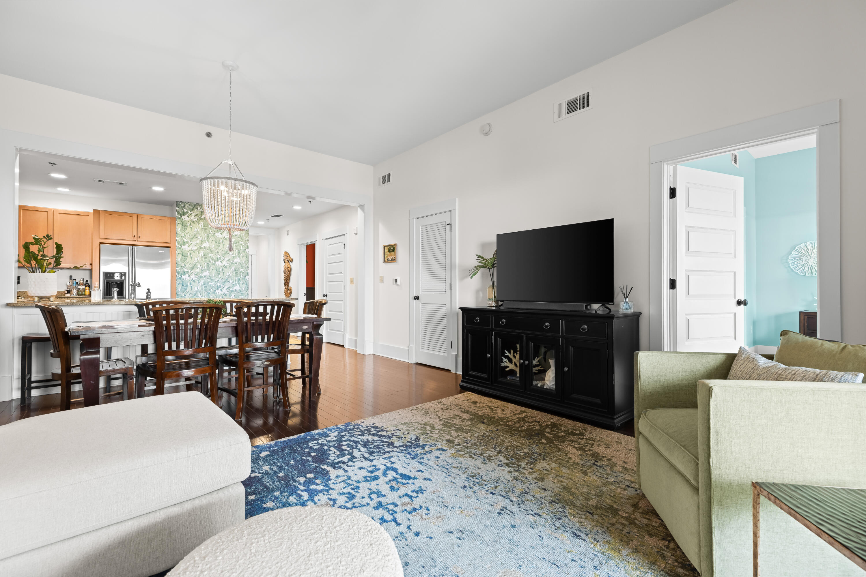 2046 West County Highway 30A, Unit M2428 Santa Rosa Beach, FL 32459 - Photo 24 of 72 a living room with furniture and a flat screen tv