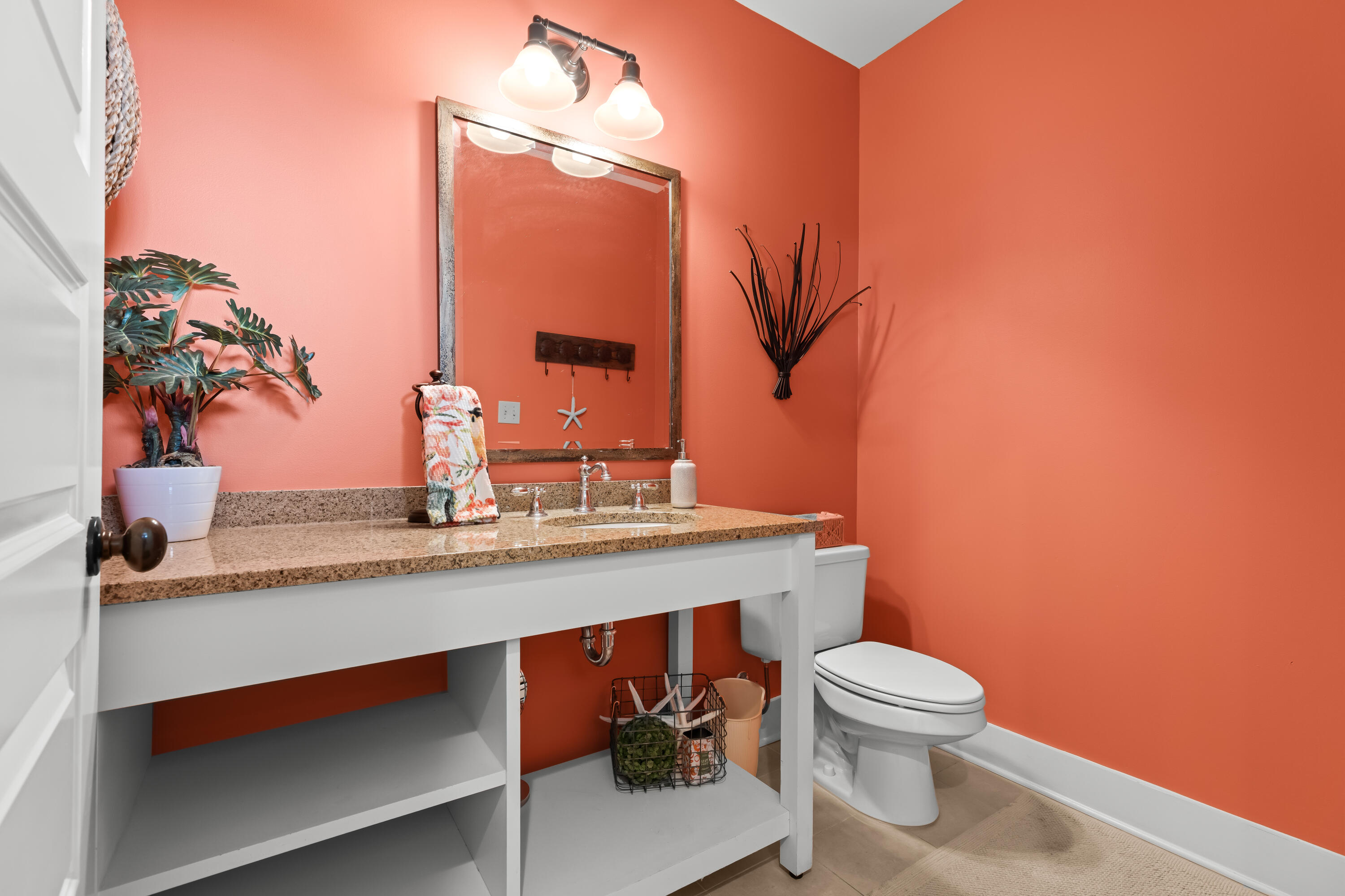 2046 West County Highway 30A, Unit M2428 Santa Rosa Beach, FL 32459 - Photo 29 of 72 a bathroom with a toilet sink and mirror