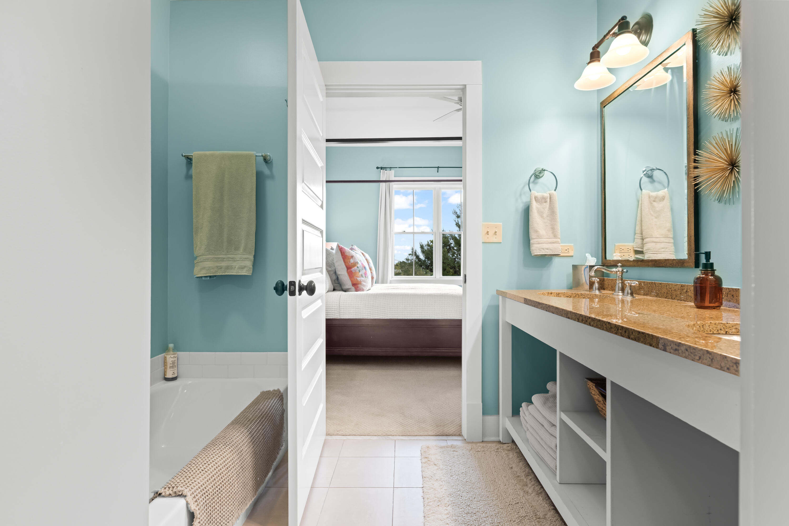 2046 West County Highway 30A, Unit M2428 Santa Rosa Beach, FL 32459 - Photo 35 of 72 a en suite bathroom with a double vanity sink a mirror and a bathtub