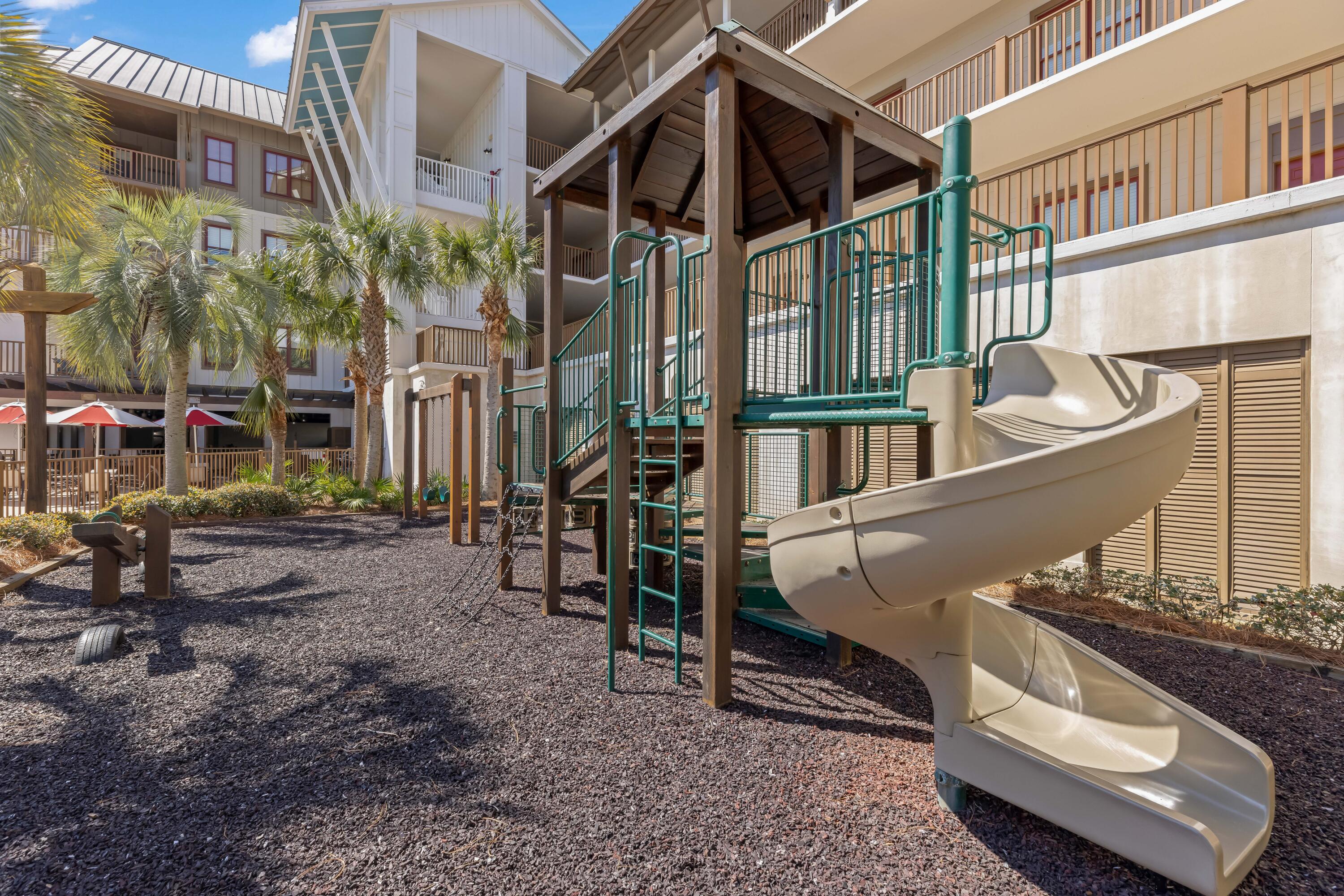 2046 West County Highway 30A, Unit M2428 Santa Rosa Beach, FL 32459 - Photo 59 of 72 a view of a house with a park